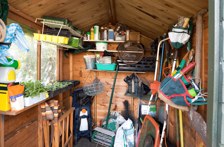 a shed filled with lots of different gardening equiptment.